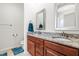 Bathroom features a double vanity with a granite countertop and framed mirrors, creating an elegant and functional space at 4963 Highcroft Dr, Cary, NC 27519