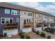 Townhome exteriors showcase balconies and attached garages at 4963 Highcroft Dr, Cary, NC 27519