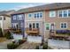 Townhome exteriors showcase balconies and attached garages at 4963 Highcroft Dr, Cary, NC 27519