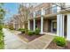 Attractive townhomes featuring covered entrances and tidy landscaping at 4963 Highcroft Dr, Cary, NC 27519