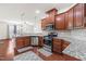 Spacious kitchen with granite countertops, stainless appliances, and open layout to dining area at 4963 Highcroft Dr, Cary, NC 27519