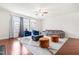Bright living room with stylish seating, ceiling fan, and hardwood floors, offering a welcoming atmosphere at 4963 Highcroft Dr, Cary, NC 27519