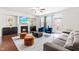 Cozy living room with a fireplace, comfortable seating, and plenty of natural light at 4963 Highcroft Dr, Cary, NC 27519