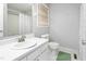 Traditional bathroom with white fixtures, including a sink, toilet, and shower with curtain at 514 Peele St # A, Burlington, NC 27215