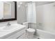 Bright bathroom with a white sink and vanity, a toilet, and a shower-tub combination at 514 Peele St # A, Burlington, NC 27215