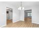 Open-concept dining area with wood flooring, neutral walls, and seamless access to the kitchen at 514 Peele St # A, Burlington, NC 27215