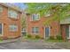 Attractive brick townhome featuring lush greenery and a well-kept exterior in a peaceful neighborhood at 514 Peele St # A, Burlington, NC 27215