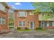 Charming brick townhome with a beautiful arched window and well-maintained landscaping in a residential neighborhood at 514 Peele St # A, Burlington, NC 27215