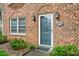 Close-up of front door with decorative lanterns, well-manicured bushes and the address 514 at 514 Peele St # A, Burlington, NC 27215