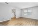 Spacious living room with light gray walls, wood flooring, and a view of the staircase at 514 Peele St # A, Burlington, NC 27215