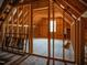 Unfinished attic with exposed framing and natural light at 6720 Colleen Rd, Rocky Mount, NC 27803