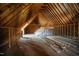 Unfinished attic space ready for customization, featuring wooden beams and ample room for storage or conversion at 6720 Colleen Rd, Rocky Mount, NC 27803