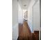 Inviting hallway featuring hardwood floors, decorative molding, and access to various rooms within the home at 6720 Colleen Rd, Rocky Mount, NC 27803