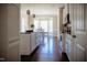 Open-concept kitchen leading into dining area, stainless appliances, island and granite counters at 6720 Colleen Rd, Rocky Mount, NC 27803