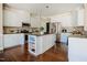 Gourmet kitchen showcasing a center island, granite counters, stainless appliances and white cabinetry at 6720 Colleen Rd, Rocky Mount, NC 27803