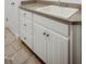 Laundry room features a sink with cabinets and a tile floor at 6720 Colleen Rd, Rocky Mount, NC 27803