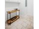 Bright laundry room with tile floor, modern accents, and wooden table at 6720 Colleen Rd, Rocky Mount, NC 27803