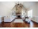Spacious living room showcasing a stone fireplace, built-in shelving, and vaulted ceilings at 6720 Colleen Rd, Rocky Mount, NC 27803