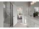 Modern bathroom featuring a glass-enclosed shower, double vanity with elegant countertop, and neutral color palette at 780 Ben Ledi Ct, Raleigh, NC 27603