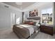 Well-lit bedroom with soft carpet, natural light, and a decorative tray ceiling, creating a peaceful retreat at 780 Ben Ledi Ct, Raleigh, NC 27603
