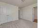 Empty bedroom with neutral carpet features closet and access to the rest of the home at 789 Old Station Pointe, Angier, NC 27501