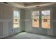Unfinished bedroom featuring large windows and ample natural light at 789 Old Station Pointe, Angier, NC 27501