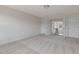 Spacious bonus room featuring carpet, baseboards, double French doors, and entry ways to other rooms at 789 Old Station Pointe, Angier, NC 27501