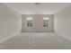Spacious bonus room featuring carpet, baseboards, a ceiling light, and two windows with beautiful outside views at 789 Old Station Pointe, Angier, NC 27501