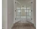 Bonus room with white double French doors with views of carpeted steps and a beautiful view at 789 Old Station Pointe, Angier, NC 27501