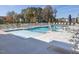 Resort-style community pool featuring ample seating and accessible lift for convenience at 789 Old Station Pointe, Angier, NC 27501