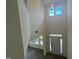 Bright foyer featuring a soaring ceiling, transom windows, and a view of the front door at 789 Old Station Pointe, Angier, NC 27501