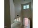 Bright foyer featuring soaring ceilings, large windows, and an open doorway leading outside at 789 Old Station Pointe, Angier, NC 27501