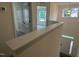 Bright hallway with white walls and carpeted floors and natural light from a window above the entryway at 789 Old Station Pointe, Angier, NC 27501