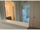 Hallway featuring doorway to a bathroom and access to other rooms with neutral paint at 789 Old Station Pointe, Angier, NC 27501