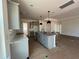 Spacious kitchen boasts a central island with a sink, stylish pendant lights, and ample storage at 789 Old Station Pointe, Angier, NC 27501