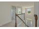 Second story landing with views to entryway, bedrooms, and stairway at 789 Old Station Pointe, Angier, NC 27501