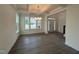 Open-concept living area with coffered ceilings, hardwood floors, and natural light at 789 Old Station Pointe, Angier, NC 27501