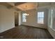 Bright living space with coffered ceiling, hardwood floors, and large windows at 789 Old Station Pointe, Angier, NC 27501