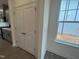 Pantry closet door beside a window near the kitchen at 789 Old Station Pointe, Angier, NC 27501