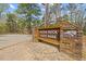 Welcome to Raven Rock State Park sign with wood frame and natural stone columns at 789 Old Station Pointe, Angier, NC 27501