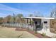 Community pool area with a covered pavilion and black metal perimeter fencing at 789 Old Station Pointe, Angier, NC 27501