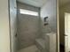 Modern tiled shower with built-in bench and niche, offering a luxurious bathing experience at 789 Old Station Pointe, Angier, NC 27501