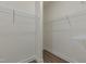 Organized walk-in closet featuring wire shelving and laminate flooring at 789 Old Station Pointe, Angier, NC 27501