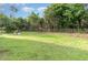 Spacious backyard, showcasing fence and greenery at 820 Newcombe Rd, Raleigh, NC 27610