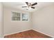 Bedroom features wood floors and a ceiling fan at 820 Newcombe Rd, Raleigh, NC 27610