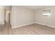 Bedroom with wood-look flooring and a view of the outside through a window at 820 Newcombe Rd, Raleigh, NC 27610