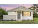 Charming home featuring a grey front door and a well-manicured lawn with flowerbeds at 820 Newcombe Rd, Raleigh, NC 27610