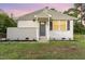 Charming single-story home with a well-manicured front yard and gray front door at 820 Newcombe Rd, Raleigh, NC 27610