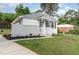 Charming home with neatly kept front yard and inviting exterior with grey and white paint at 820 Newcombe Rd, Raleigh, NC 27610