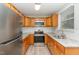 Updated kitchen featuring stainless steel appliances, granite countertops, and light wood cabinets at 820 Newcombe Rd, Raleigh, NC 27610
